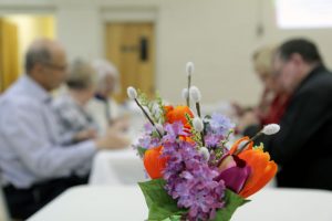 Diner's Club - bouquet on a dinner table