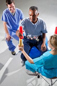 Post Stroke Transitional Care - man getting physiotherapy